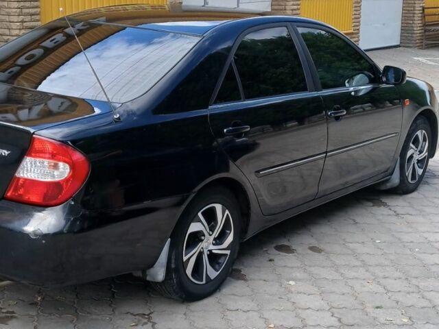 Черный Тойота Камри, объемом двигателя 2.4 л и пробегом 307 тыс. км за 4500 $, фото 9 на Automoto.ua