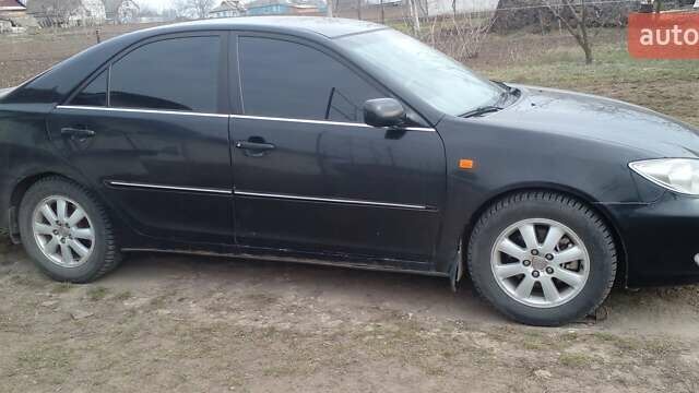 Черный Тойота Камри, объемом двигателя 2.4 л и пробегом 298 тыс. км за 5200 $, фото 11 на Automoto.ua