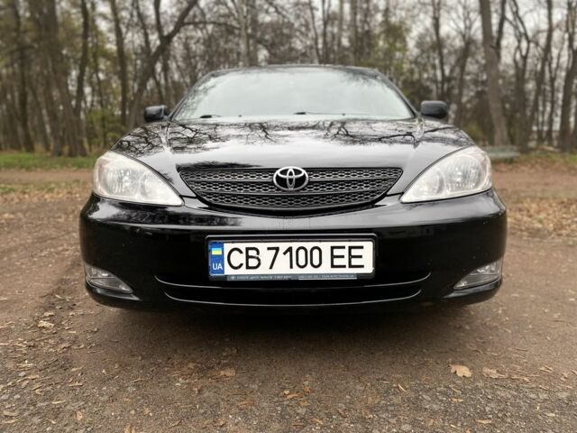 Чорний Тойота Камрі, об'ємом двигуна 2.4 л та пробігом 201 тис. км за 6999 $, фото 2 на Automoto.ua