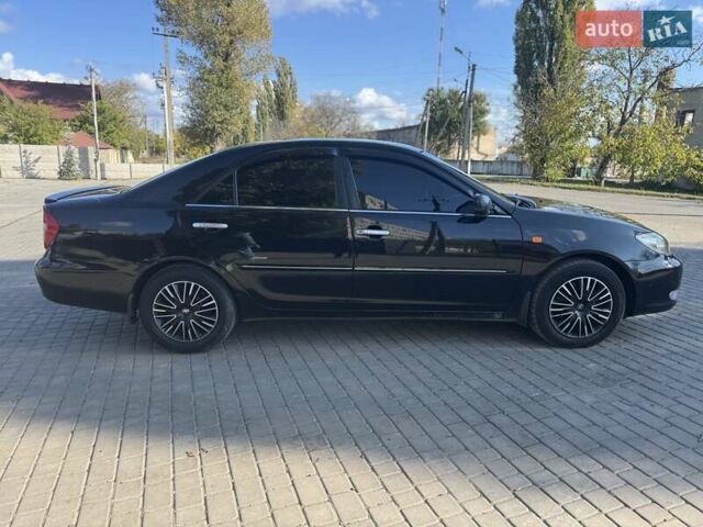 Чорний Тойота Камрі, об'ємом двигуна 2.4 л та пробігом 320 тис. км за 5500 $, фото 7 на Automoto.ua