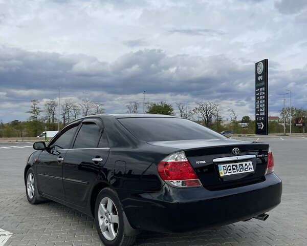 Черный Тойота Камри, объемом двигателя 2.4 л и пробегом 225 тыс. км за 7500 $, фото 7 на Automoto.ua