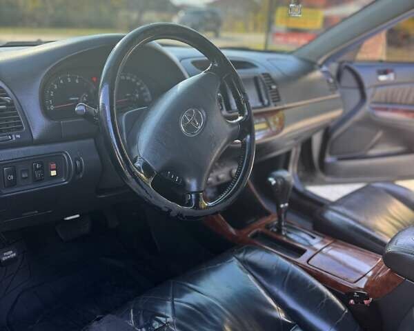 Чорний Тойота Камрі, об'ємом двигуна 2.4 л та пробігом 320 тис. км за 5500 $, фото 10 на Automoto.ua