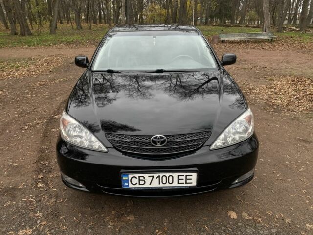 Чорний Тойота Камрі, об'ємом двигуна 2.4 л та пробігом 201 тис. км за 6999 $, фото 1 на Automoto.ua