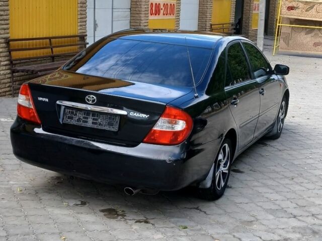 Черный Тойота Камри, объемом двигателя 2.4 л и пробегом 307 тыс. км за 4500 $, фото 8 на Automoto.ua