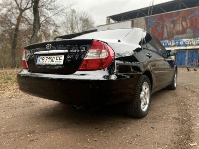 Чорний Тойота Камрі, об'ємом двигуна 2.4 л та пробігом 201 тис. км за 6999 $, фото 6 на Automoto.ua