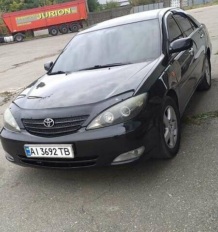 Чорний Тойота Камрі, об'ємом двигуна 2.4 л та пробігом 300 тис. км за 6500 $, фото 2 на Automoto.ua