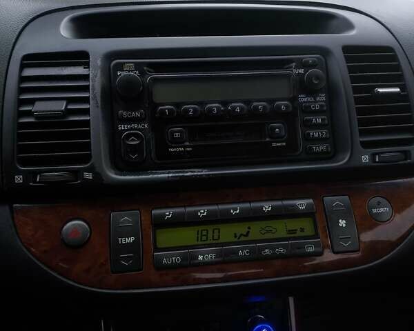 Черный Тойота Камри, объемом двигателя 2.4 л и пробегом 275 тыс. км за 4800 $, фото 13 на Automoto.ua