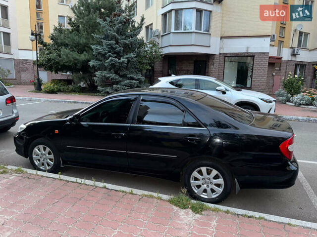 Чорний Тойота Камрі, об'ємом двигуна 3 л та пробігом 328 тис. км за 6600 $, фото 3 на Automoto.ua