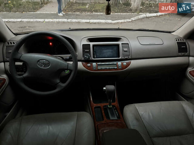 Черный Тойота Камри, объемом двигателя 2.36 л и пробегом 353 тыс. км за 6500 $, фото 27 на Automoto.ua