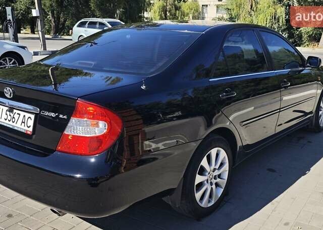 Чорний Тойота Камрі, об'ємом двигуна 2.36 л та пробігом 375 тис. км за 7600 $, фото 3 на Automoto.ua