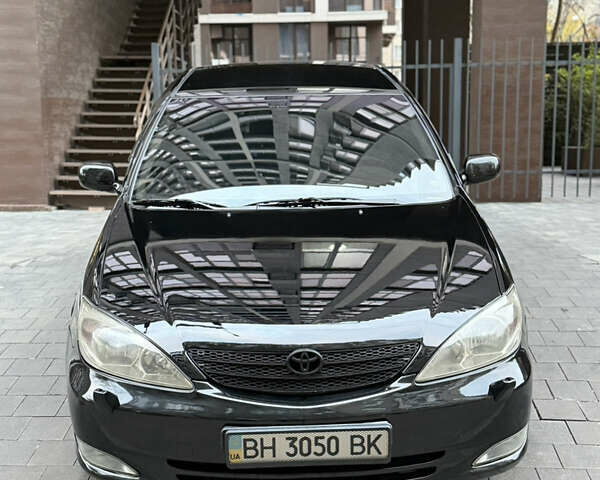 Черный Тойота Камри, объемом двигателя 2.36 л и пробегом 353 тыс. км за 6500 $, фото 3 на Automoto.ua