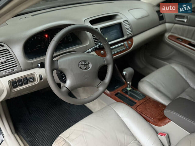 Черный Тойота Камри, объемом двигателя 2.36 л и пробегом 353 тыс. км за 6500 $, фото 18 на Automoto.ua