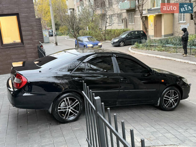 Черный Тойота Камри, объемом двигателя 2.36 л и пробегом 353 тыс. км за 6500 $, фото 14 на Automoto.ua