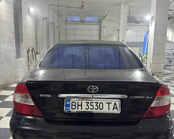 Черный Тойота Камри, объемом двигателя 2.36 л и пробегом 527 тыс. км за 5400 $, фото 1 на Automoto.ua