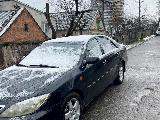 Черный Тойота Камри, объемом двигателя 2.5 л и пробегом 294 тыс. км за 7000 $, фото 2 на Automoto.ua