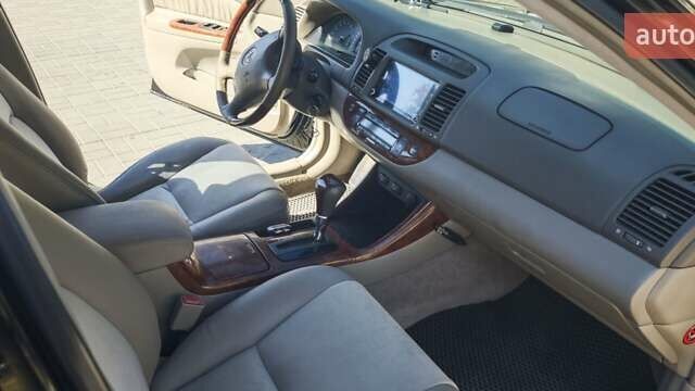 Чорний Тойота Камрі, об'ємом двигуна 2.36 л та пробігом 375 тис. км за 7600 $, фото 5 на Automoto.ua