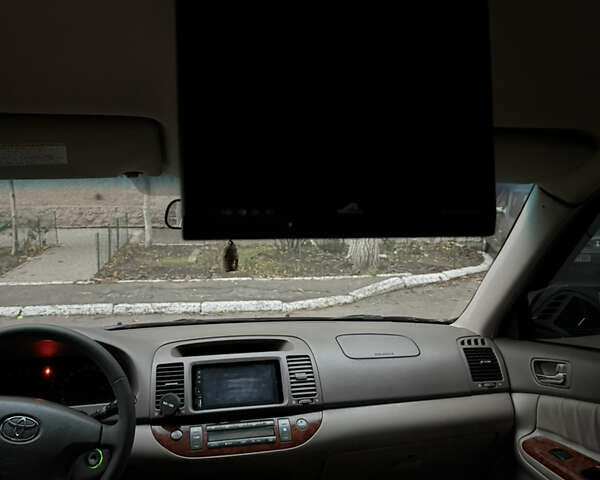 Черный Тойота Камри, объемом двигателя 2.36 л и пробегом 353 тыс. км за 6500 $, фото 26 на Automoto.ua