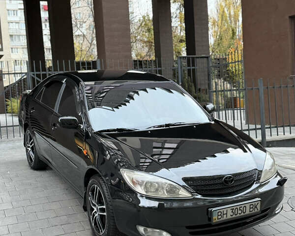 Черный Тойота Камри, объемом двигателя 2.36 л и пробегом 353 тыс. км за 6500 $, фото 2 на Automoto.ua