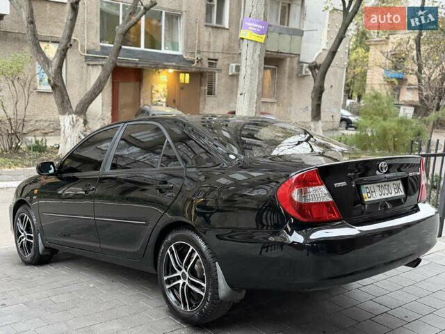 Черный Тойота Камри, объемом двигателя 2.36 л и пробегом 353 тыс. км за 6500 $, фото 11 на Automoto.ua