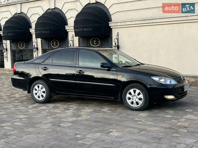 Черный Тойота Камри, объемом двигателя 2.4 л и пробегом 325 тыс. км за 4500 $, фото 3 на Automoto.ua