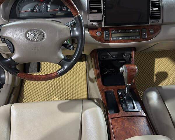 Черный Тойота Камри, объемом двигателя 2.36 л и пробегом 527 тыс. км за 5400 $, фото 21 на Automoto.ua