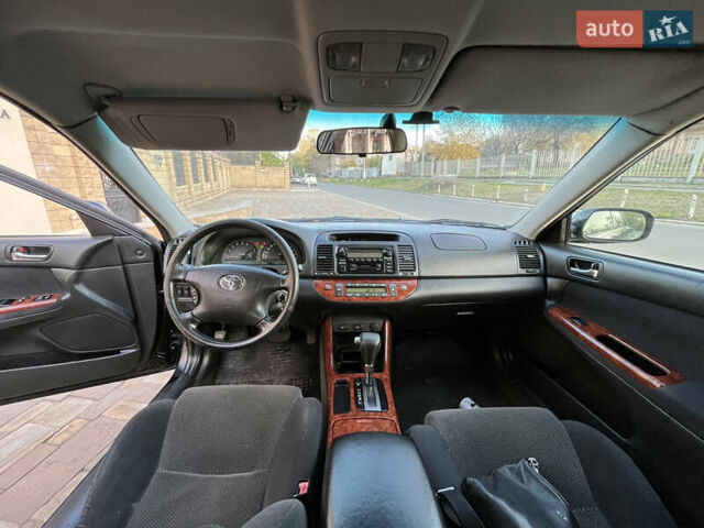 Черный Тойота Камри, объемом двигателя 2.4 л и пробегом 325 тыс. км за 4500 $, фото 8 на Automoto.ua