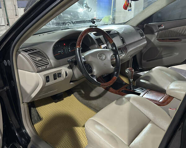 Черный Тойота Камри, объемом двигателя 2.36 л и пробегом 527 тыс. км за 5400 $, фото 18 на Automoto.ua