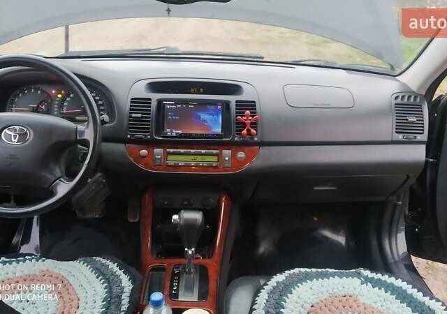 Черный Тойота Камри, объемом двигателя 2.4 л и пробегом 290 тыс. км за 7000 $, фото 5 на Automoto.ua