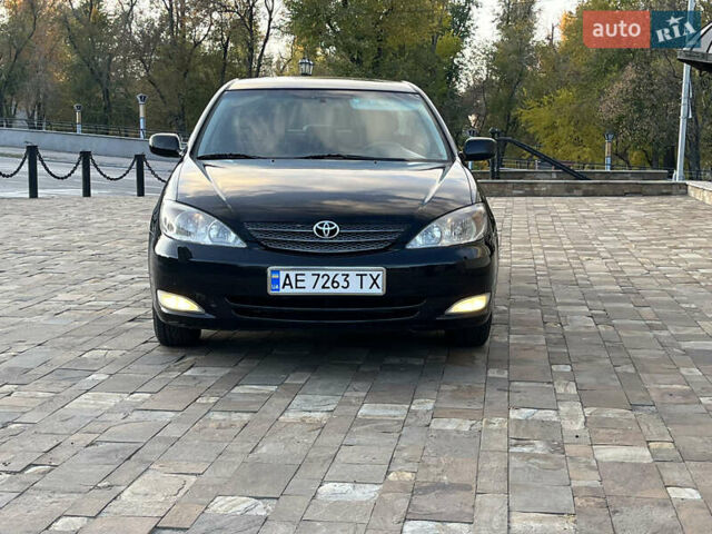 Черный Тойота Камри, объемом двигателя 2.4 л и пробегом 325 тыс. км за 4500 $, фото 1 на Automoto.ua