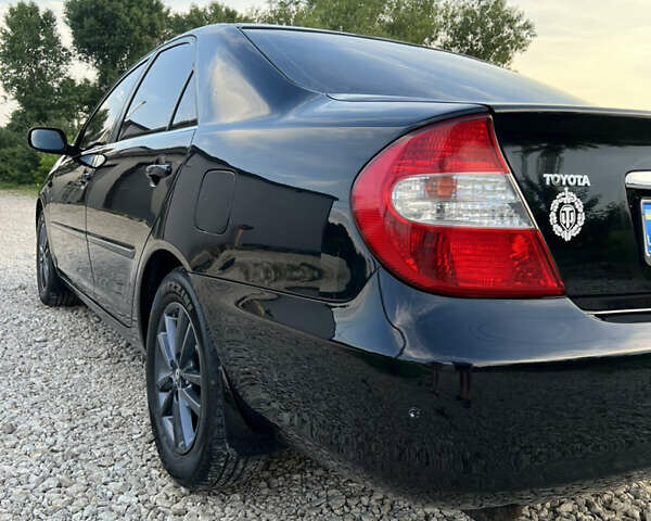 Чорний Тойота Камрі, об'ємом двигуна 2.36 л та пробігом 511 тис. км за 7600 $, фото 12 на Automoto.ua