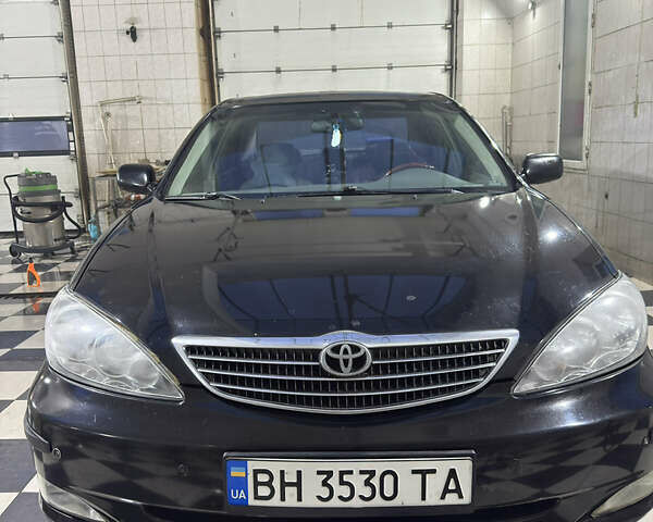 Черный Тойота Камри, объемом двигателя 2.36 л и пробегом 527 тыс. км за 5400 $, фото 6 на Automoto.ua