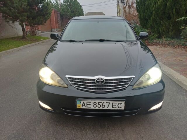 Черный Тойота Камри, объемом двигателя 2.4 л и пробегом 250 тыс. км за 5500 $, фото 1 на Automoto.ua