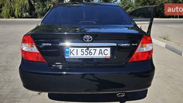Чорний Тойота Камрі, об'ємом двигуна 2.36 л та пробігом 375 тис. км за 7600 $, фото 11 на Automoto.ua