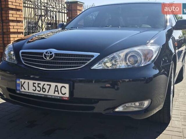Чорний Тойота Камрі, об'ємом двигуна 2.36 л та пробігом 375 тис. км за 7600 $, фото 1 на Automoto.ua