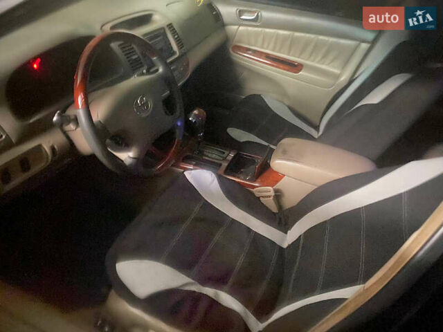 Черный Тойота Камри, объемом двигателя 2.36 л и пробегом 361 тыс. км за 3999 $, фото 4 на Automoto.ua