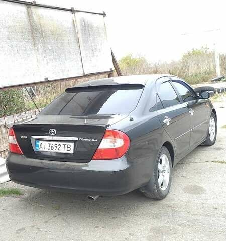 Чорний Тойота Камрі, об'ємом двигуна 2.4 л та пробігом 300 тис. км за 6500 $, фото 3 на Automoto.ua