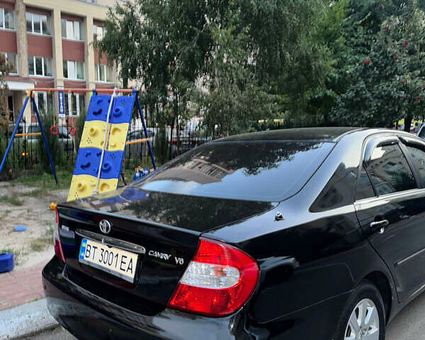 Чорний Тойота Камрі, об'ємом двигуна 3 л та пробігом 328 тис. км за 6600 $, фото 1 на Automoto.ua