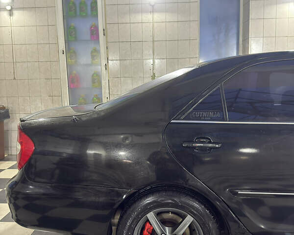 Черный Тойота Камри, объемом двигателя 2.36 л и пробегом 527 тыс. км за 5400 $, фото 3 на Automoto.ua