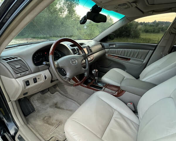 Чорний Тойота Камрі, об'ємом двигуна 2.36 л та пробігом 511 тис. км за 7600 $, фото 27 на Automoto.ua