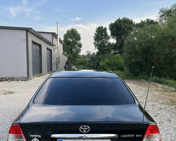 Чорний Тойота Камрі, об'ємом двигуна 2.36 л та пробігом 511 тис. км за 7600 $, фото 13 на Automoto.ua