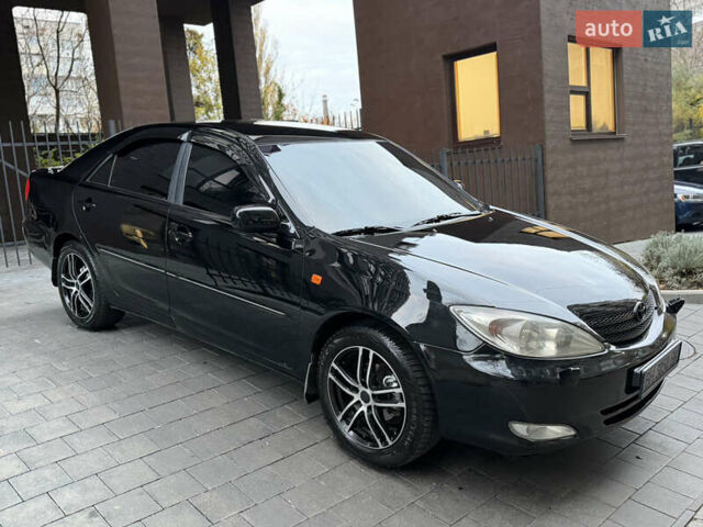 Черный Тойота Камри, объемом двигателя 2.36 л и пробегом 353 тыс. км за 6500 $, фото 16 на Automoto.ua