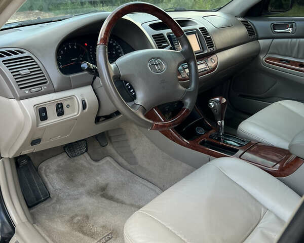 Чорний Тойота Камрі, об'ємом двигуна 2.36 л та пробігом 511 тис. км за 7600 $, фото 25 на Automoto.ua