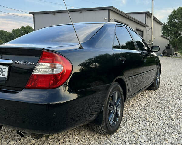 Чорний Тойота Камрі, об'ємом двигуна 2.36 л та пробігом 511 тис. км за 7600 $, фото 11 на Automoto.ua