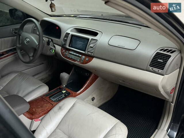 Черный Тойота Камри, объемом двигателя 2.36 л и пробегом 353 тыс. км за 6500 $, фото 22 на Automoto.ua