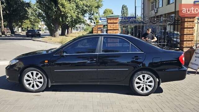Чорний Тойота Камрі, об'ємом двигуна 2.36 л та пробігом 375 тис. км за 7600 $, фото 10 на Automoto.ua