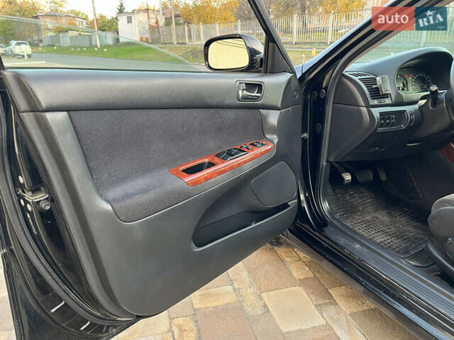 Черный Тойота Камри, объемом двигателя 2.4 л и пробегом 325 тыс. км за 4500 $, фото 9 на Automoto.ua