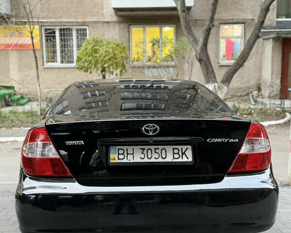 Черный Тойота Камри, объемом двигателя 2.36 л и пробегом 353 тыс. км за 6500 $, фото 7 на Automoto.ua