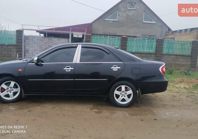 Черный Тойота Камри, объемом двигателя 2.4 л и пробегом 290 тыс. км за 7000 $, фото 3 на Automoto.ua