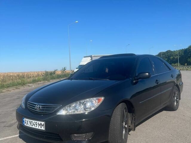 Чорний Тойота Камрі, об'ємом двигуна 2.4 л та пробігом 240 тис. км за 6200 $, фото 3 на Automoto.ua