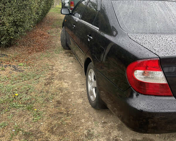 Черный Тойота Камри, объемом двигателя 3 л и пробегом 340 тыс. км за 6700 $, фото 11 на Automoto.ua